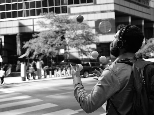 man juggling  on the street