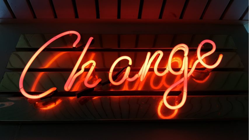 change in red neon letters