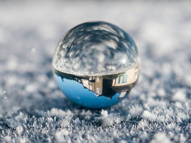 Crystal Ball with a reflection of a house.