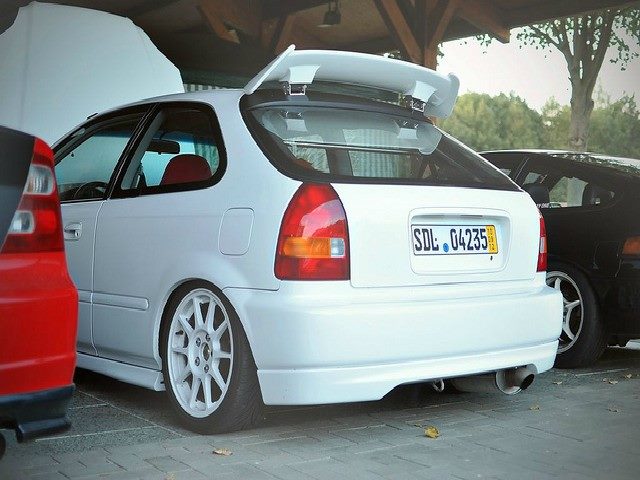 White car with "SDL" on the license plate. SDL is driving toward a focus on language and content.