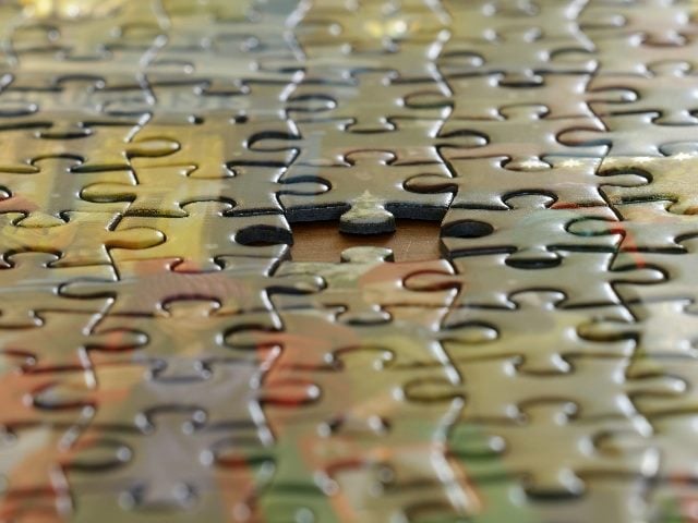 Puzzle showing one missing piece.