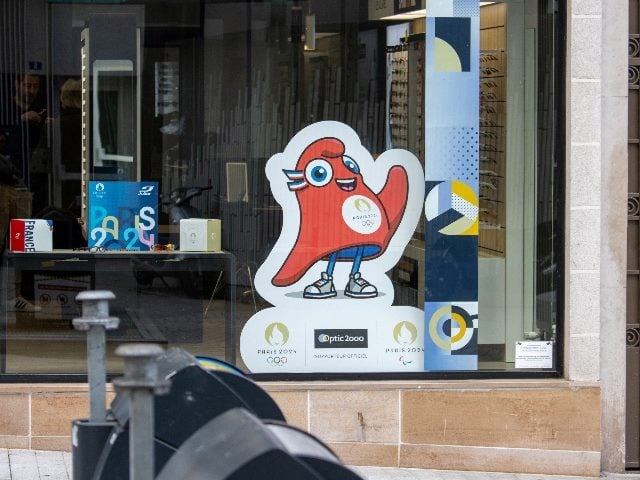Display of Paris 2024 Olympic Games mascot at a store in France.