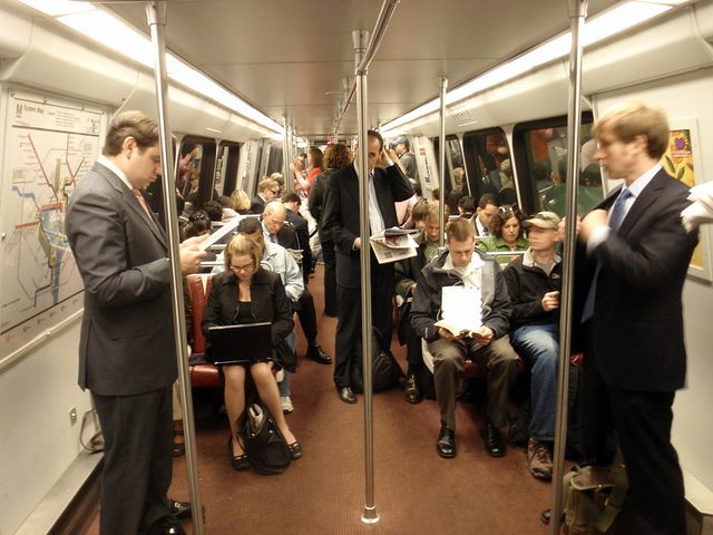 commuters working on a train