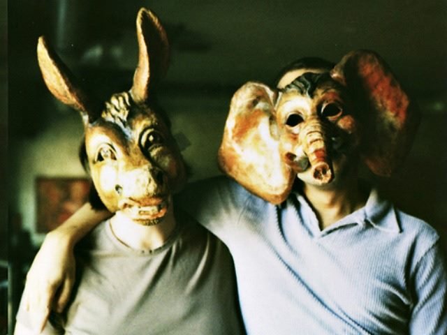 2 people wearing masks