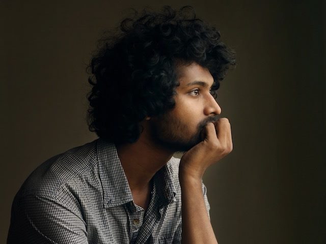 man holding his head  in thought