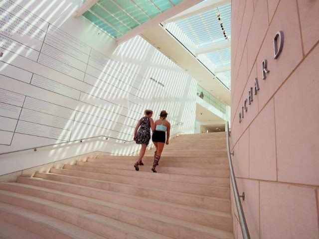 women walking up steps