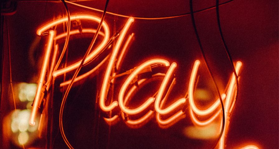 red neon play sign