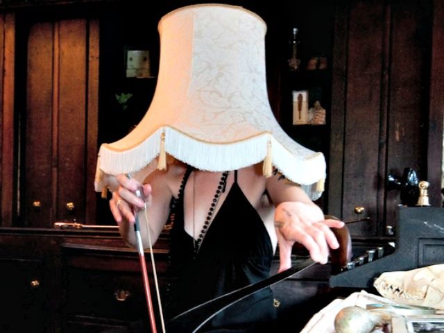 woman with lampshade on head