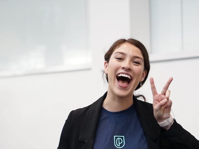 enthusiastic woman flashing a peace sign