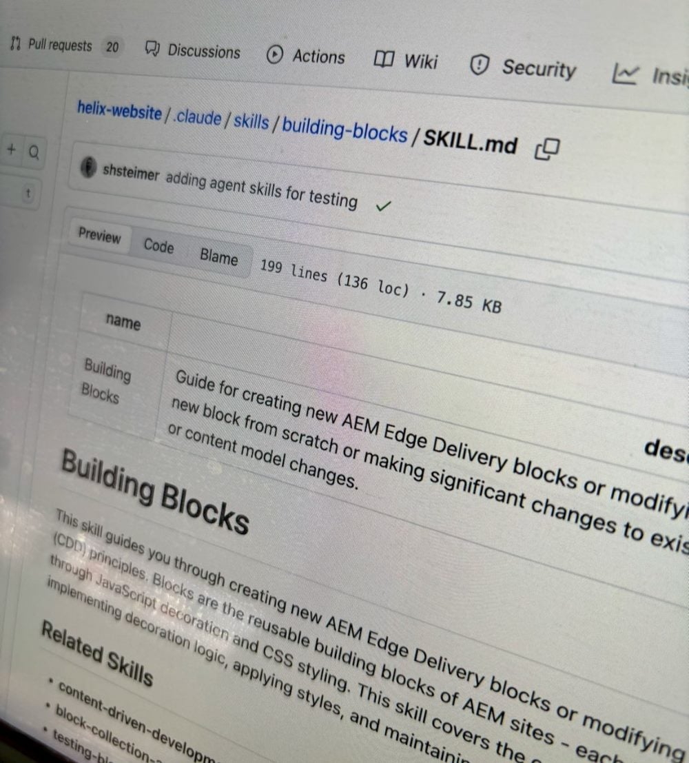 A laptop screen displaying a GitHub repository for Adobe Experience Manager Edge Delivery Services, showing a SKILL.md file with commit details and documentation for building blocks.
