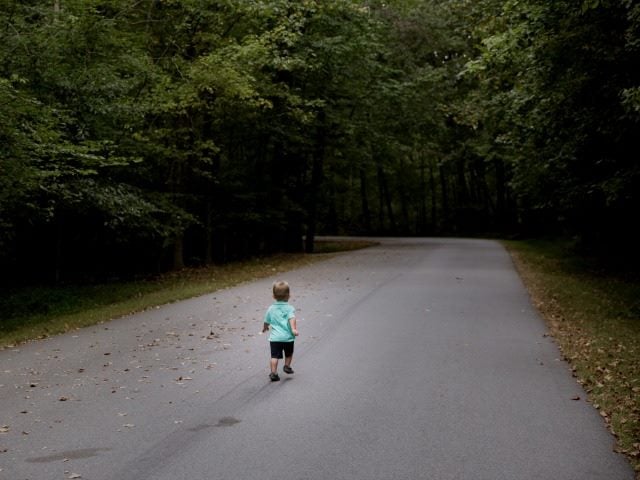 child running down the road