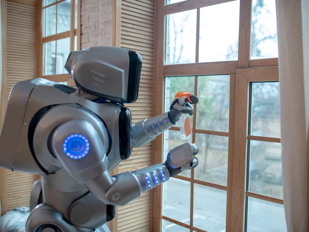 Big robot cleaning the window in the kitchen.
