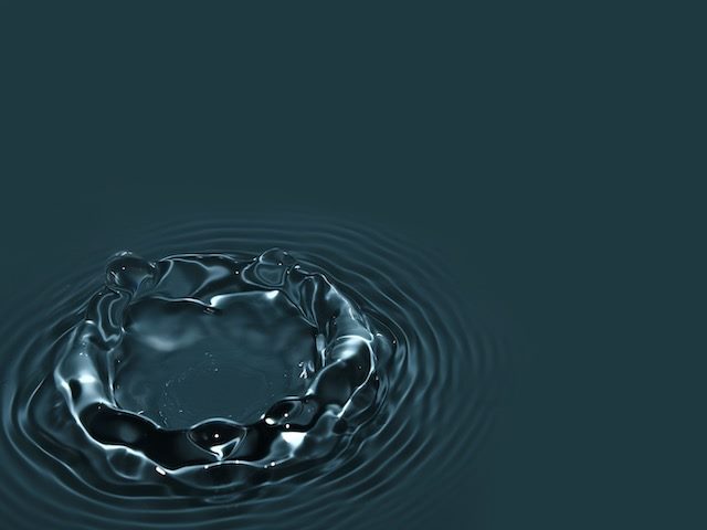 droplet of water radiating  out, the ripple effect
