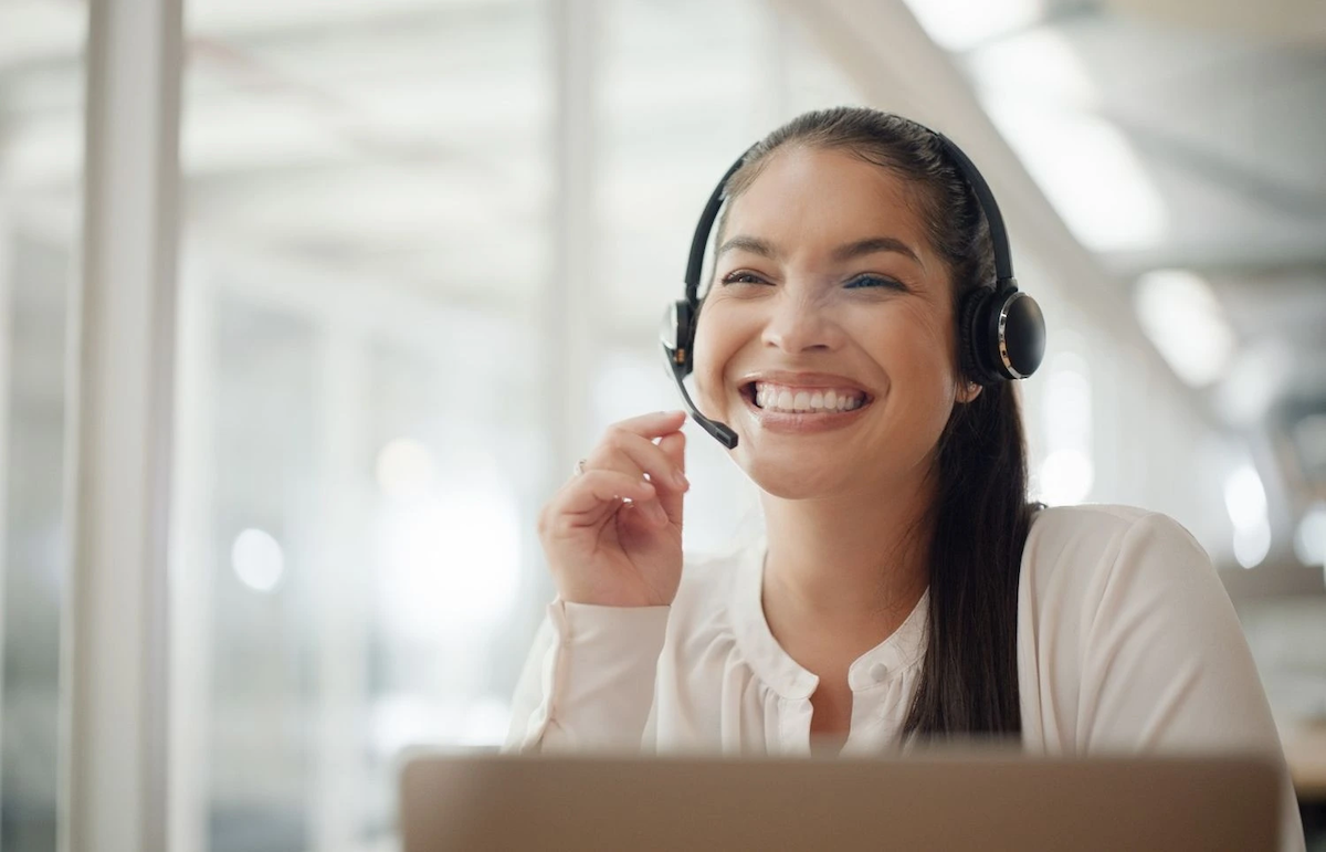 Smiling woman with headset