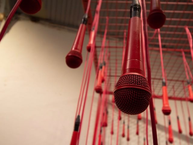 microphones hanging from the ceiling