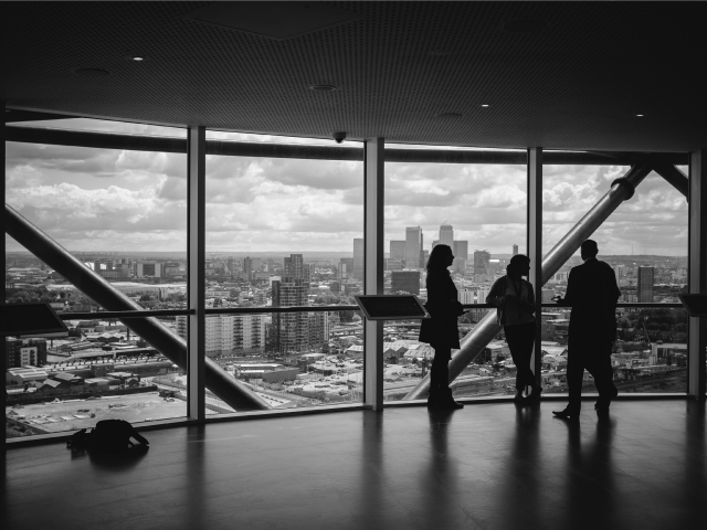 3 people-talking-in-biz-highrise