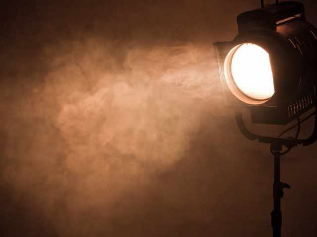 An antique spotlight shining down