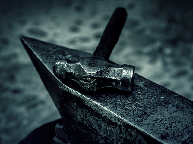 Hammer and anvil, detail of a forge - messaging concept