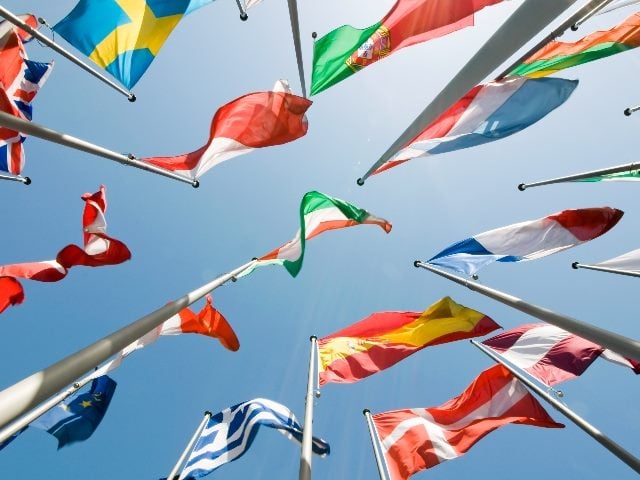 International flags shown from the bottom, representing how marketers need to understand cultural marketing.