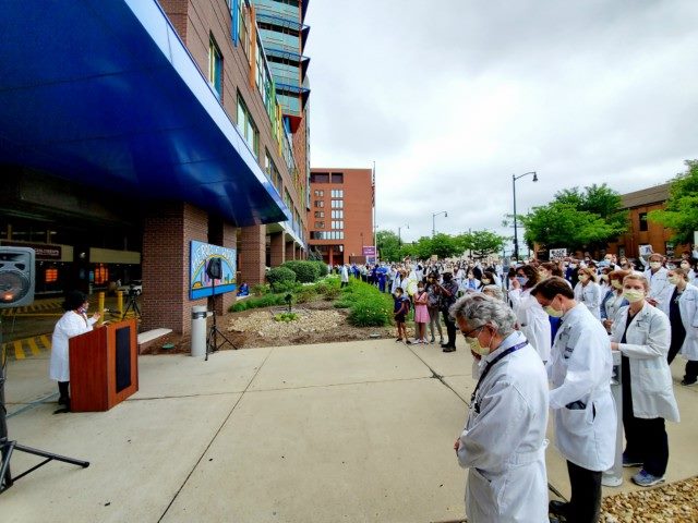 Sylvia Owusu-Ansah MD, MPH, FAAP, speaks at a podium to a gathering of healthcare workers at UPMC Children’s Hospital of Pittsburgh and UPMC Presbyterian on June 5, 2020