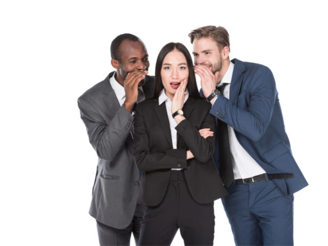 Two businessmen sharing secrets with a third businesswoman, on how to improve business outcomes in their call center