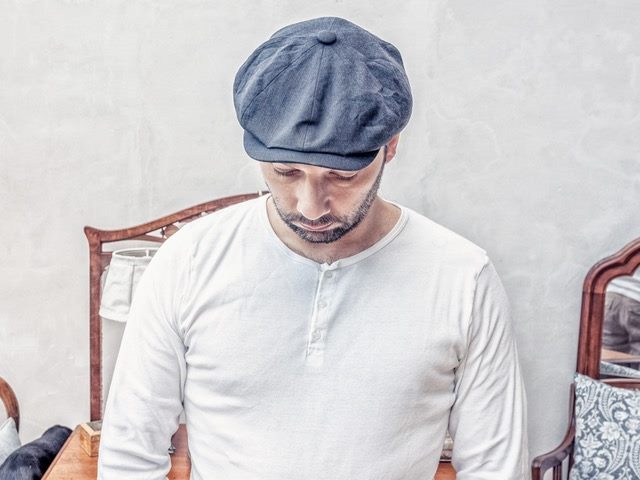 man looking down at something