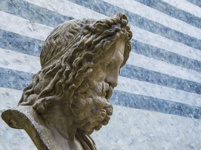 Bust of Zeus, king of the gods, with striped background