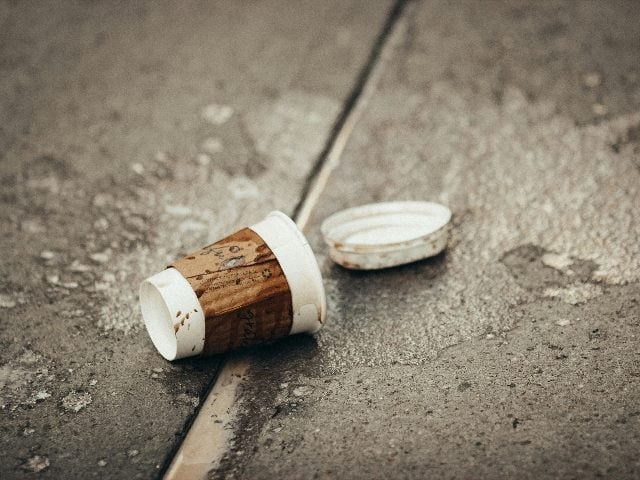 Coffee cup on the ground.