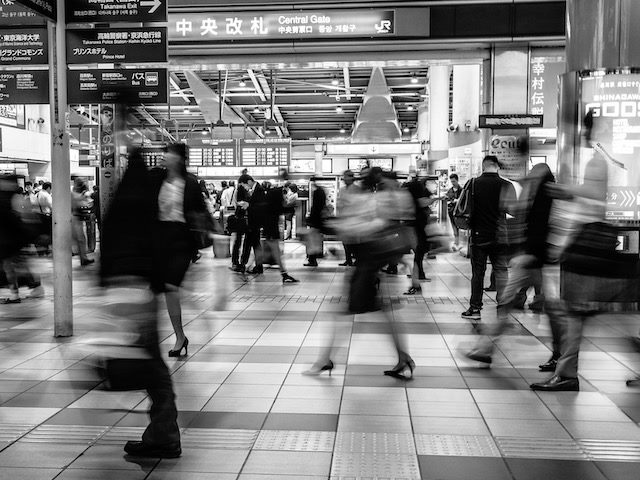 time lapse photo of busy train station
