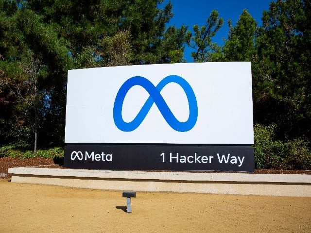 Meta sign in Menlo Park, Calif., next to the headquarters corporate office building.